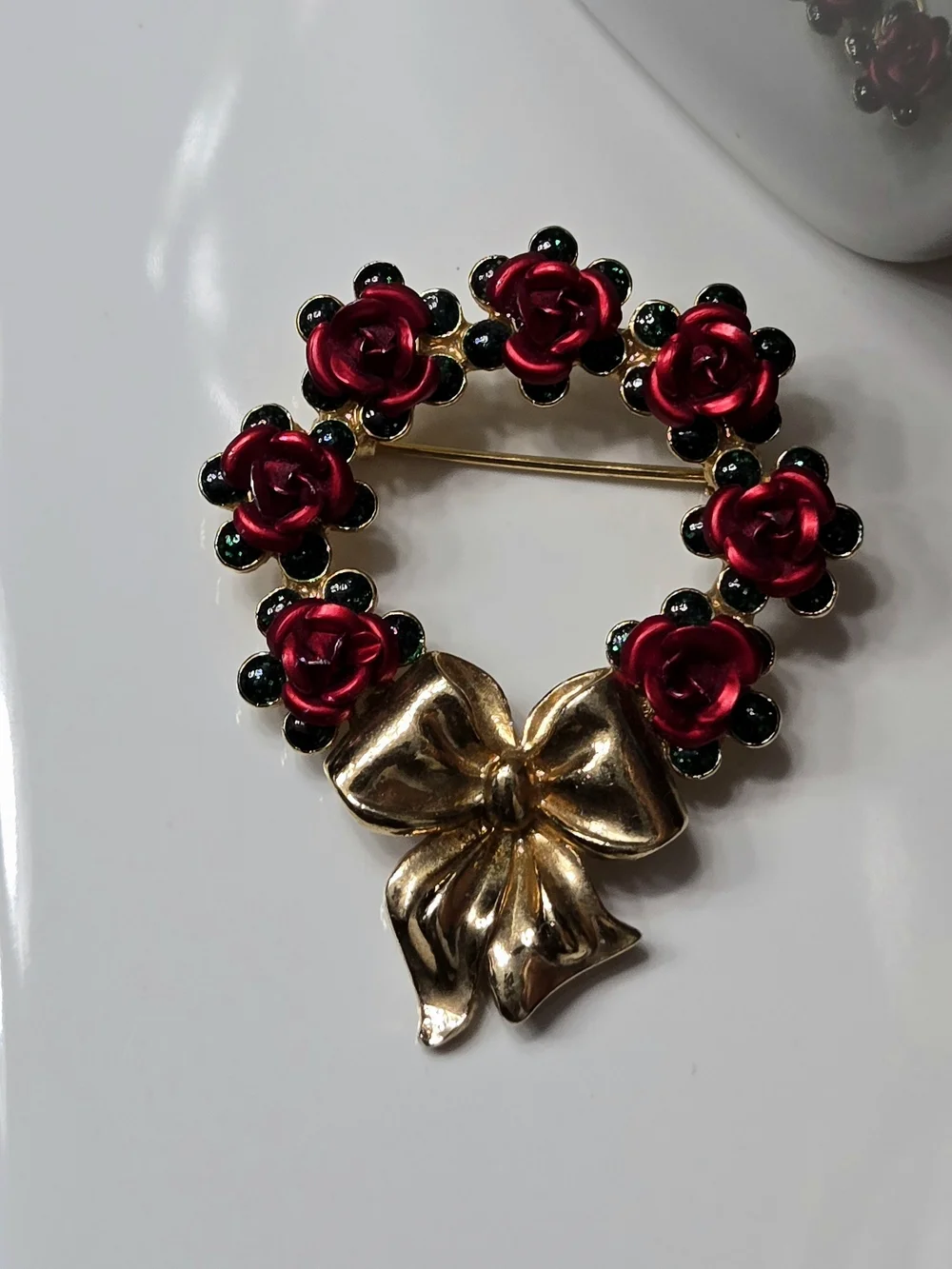 Avon Gold Bow Wreath Brooch with Red Roses and Green Accents